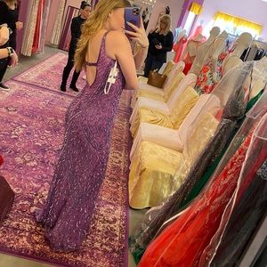 A lilac and pink sequenced prom dress.